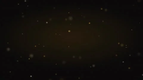 Soft golden light orbs floating weightless on near black, warm brand film loop Video stock 346955488