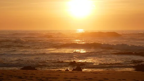 Soft golden light over the ocean at sunset at beach Stock Footage 103121675