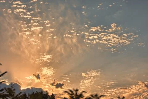 Soft golden sunset clouds over   August 2025 Stock Photos