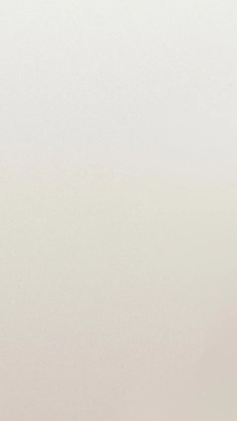 Soft gradient beige texture with grainy effect in seamless loop background. 4K. Stock Footage 309856232