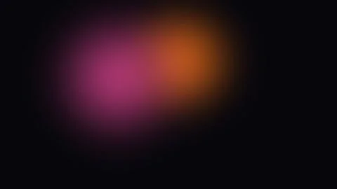A soft gradient of glowing pink and orange light on a deep black background Vídeos de archivo 338309576