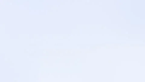 Soft gradient seamless loop background with light blue tones and subtle grainy Stock Footage 299397312