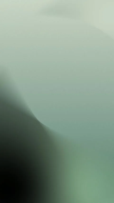 Soft gradient with shades of green and gray, seamless loop background. 4K. Видео 309956934