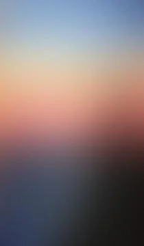 Soft gradient sky fades from blue to warm peach. Mist veils lower horizon, .. Stock Illustration