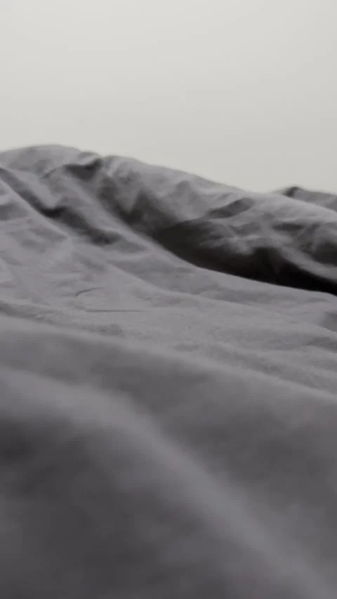 Soft Gray Bedsheet Texture in Minimal Bedroom Setting 스톡 동영상 334575198