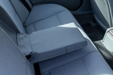 Soft gray fabric covers the back seat, offering a comfortable space for tra.. Stockfoto's