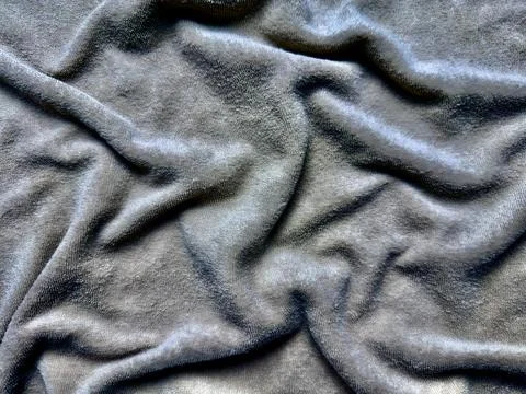Soft gray fleece texture with undulating wrinkles and elegant folds in macro  Stock Photos