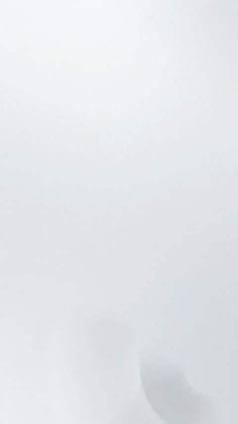 Soft gray gradient with gentle curves in seamless loop. 4K. Stock Footage 310143544