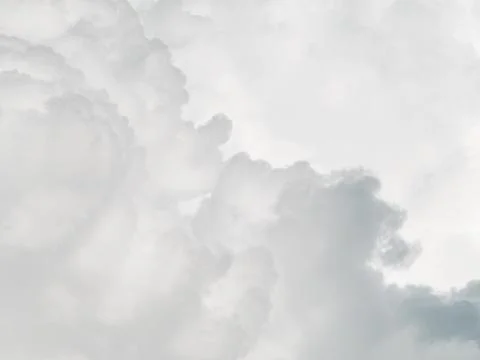 Soft gray overcast storm clouds filling sky, moody minimal weather backgrou.. Stock Photos