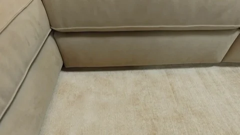 Soft gray sofa on the carpet. Close-up Stock Footage 75733053