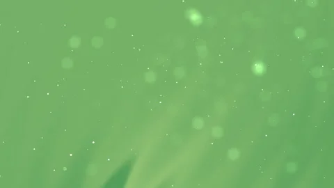 Soft green backdrop with light speckles and bokeh  Stock Footage 329949807