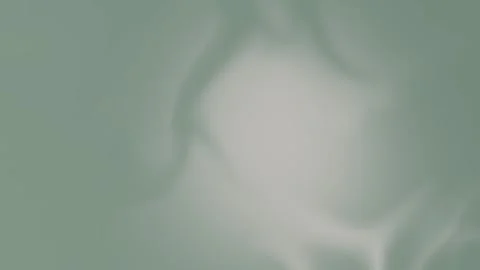 Soft green blurred abstract shapes on a smooth gradient background. Seamless Stock Footage 309956720