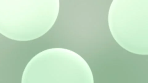 Soft green spherical shapes on a subtle gradient background. Seamless loop Vídeo Stock 309855819