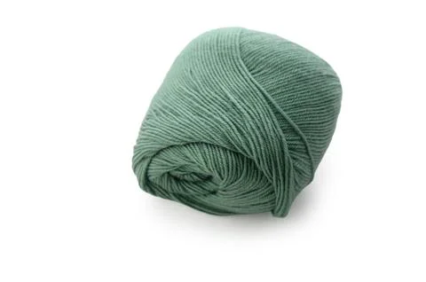 Soft, green yarn ready for creative crafting in a cozy workspace filled wit.. Foto stock