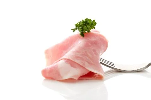 Soft ham slice wrapped on fork Stock Photos