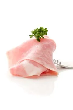Soft ham slice wrapped on fork Stock Photos