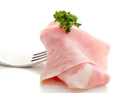 Soft ham slice wrapped on fork Stock Photos
