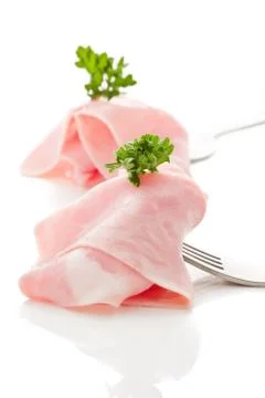 Soft ham slice wrapped on fork Stock Photos