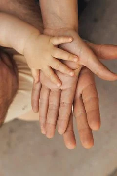 Soft hands hold each other in gentle embrace Stock-Fotos