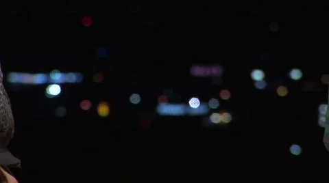 Soft handshake in front of city lights Stock Footage 67273132