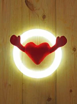 A soft heart  with two hands in circle light Stock Photos