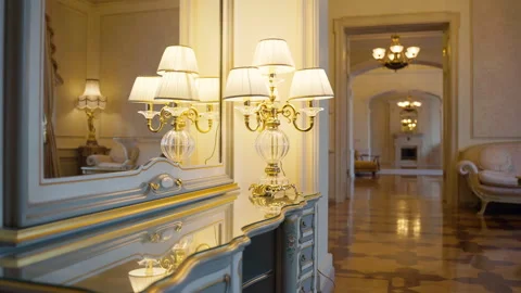 Soft illumination casting warm glow across luxurious apartment hallway Video stock 306423764