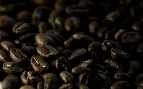 Soft image of roasted brown coffee beans. Stock Photos