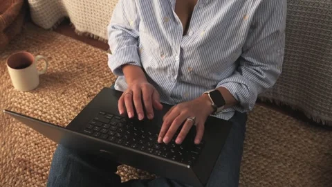 Soft keyboard clacks heard as fingers type, conveying focus and comfort. Stock Footage 320064359