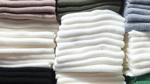 Soft knit fabric stacks in various colors Stock Footage 347644704