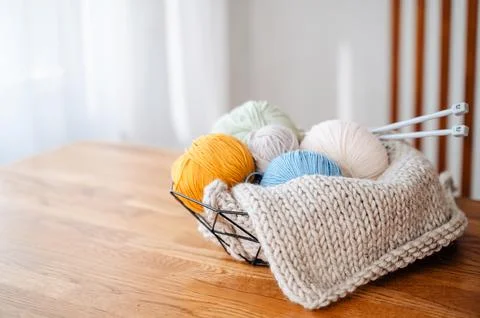 Soft knitting threads neatly arranged at home, cozy atmosphere Stock Photos