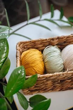 Soft knitting threads neatly arranged at home, cozy atmosphere Stock Photos