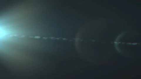 Soft lens flare glows across dark background Stock Illustration