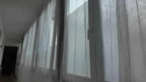 Soft Light Filters Through Sheer Curtains on a Quiet Morning in a Serene, Sunlit Stock Footage 287833769