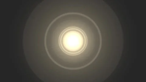 Soft light flares bloom gently in darkness with subtle concentric circles d.. Stock Footage 341543898