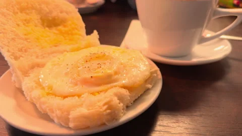 Soft light glows warmly over breakfast plate Stock Footage 340531505