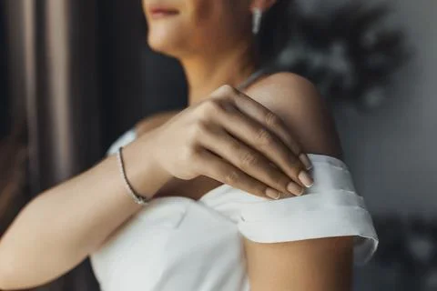 Soft light glows on a woman's shoulder Foto stock