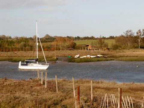 Soft light harbor scene private boats parked in estuary Foto stock