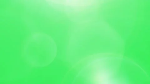 Soft Light Leaks Over Green Background Featuring Subtle Bokeh Circles and Stock Footage 338368503