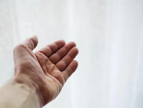 Soft light Open hand symbolizing love, trust and emotional connection Stock Photos