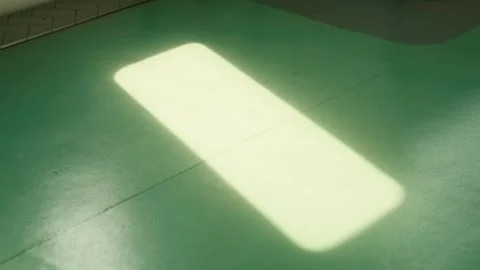 Soft Light Patch on Green Floor Stock Footage 301491999