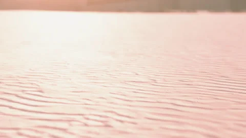 Soft light shines on sand surface at a beach during sunset Stock Footage 348556310