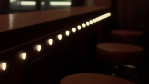 Soft Lights Illuminate a Cozy Bar Area in a Warm Setting Stock Footage 344910188