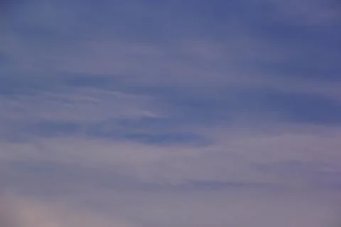 Soft lines of clouds in the sky at sunset 写真素材