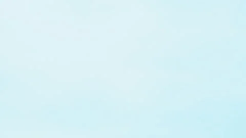 A soft, minimalistic light blue sky with faint, airy clouds creating a serene Vidéo 289133445