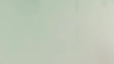 Soft mint gradient with subtle wispy shapes, creating a calming seamless loop Stock Footage 309856079