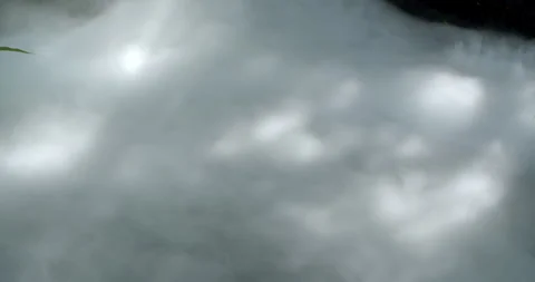 Soft mist drifting over calm water, creating a cool and serene natural atmospher Stock Footage 320318511