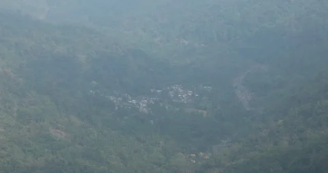 Soft mist drifts through the lush hills of Meghalaya 動画素材 335381591