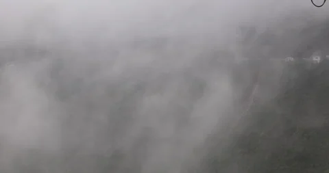 Soft mist drifts through the lush hills of Meghalaya Stock Footage 335649641