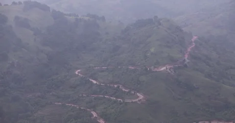 Soft mist drifts through the lush hills of Meghalaya Stock Footage 335668046