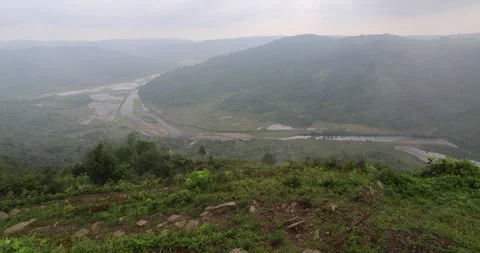 Soft mist drifts through the lush hills of Meghalaya Stock Footage 335668192